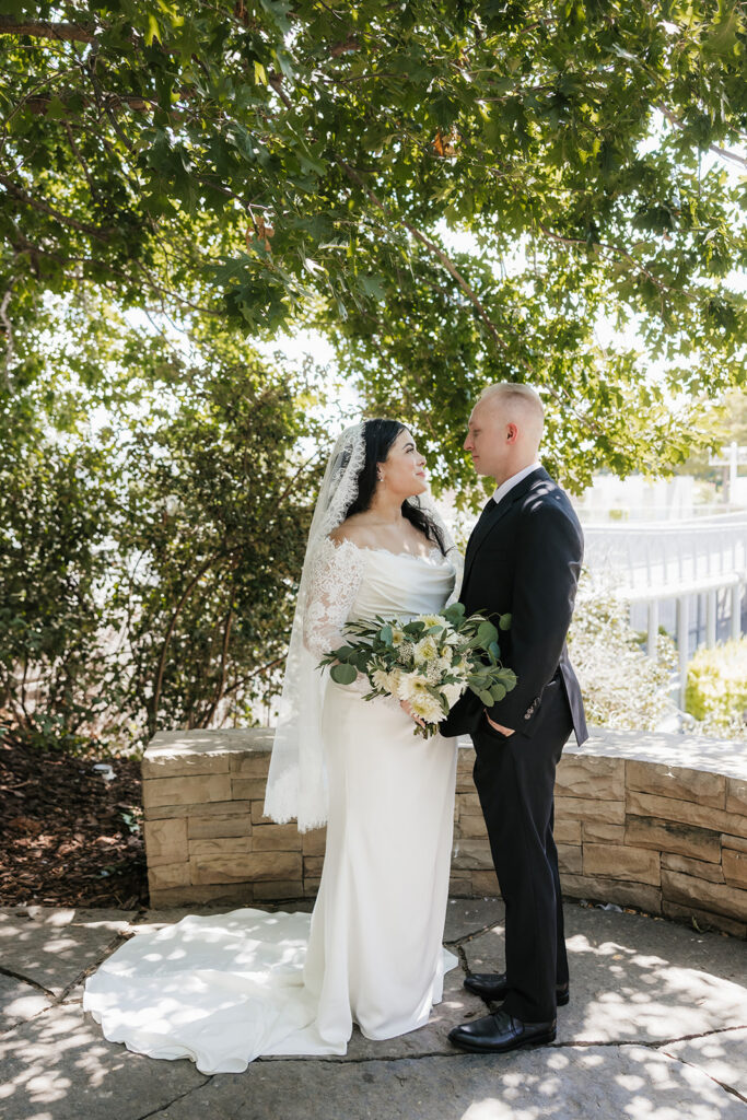 cute picture of the bride and groom smiling at each other