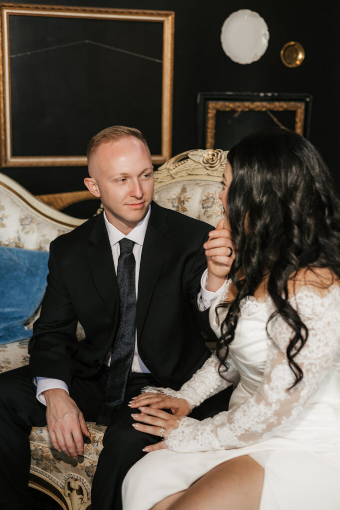 portrait of the bride and groom smiling at each other