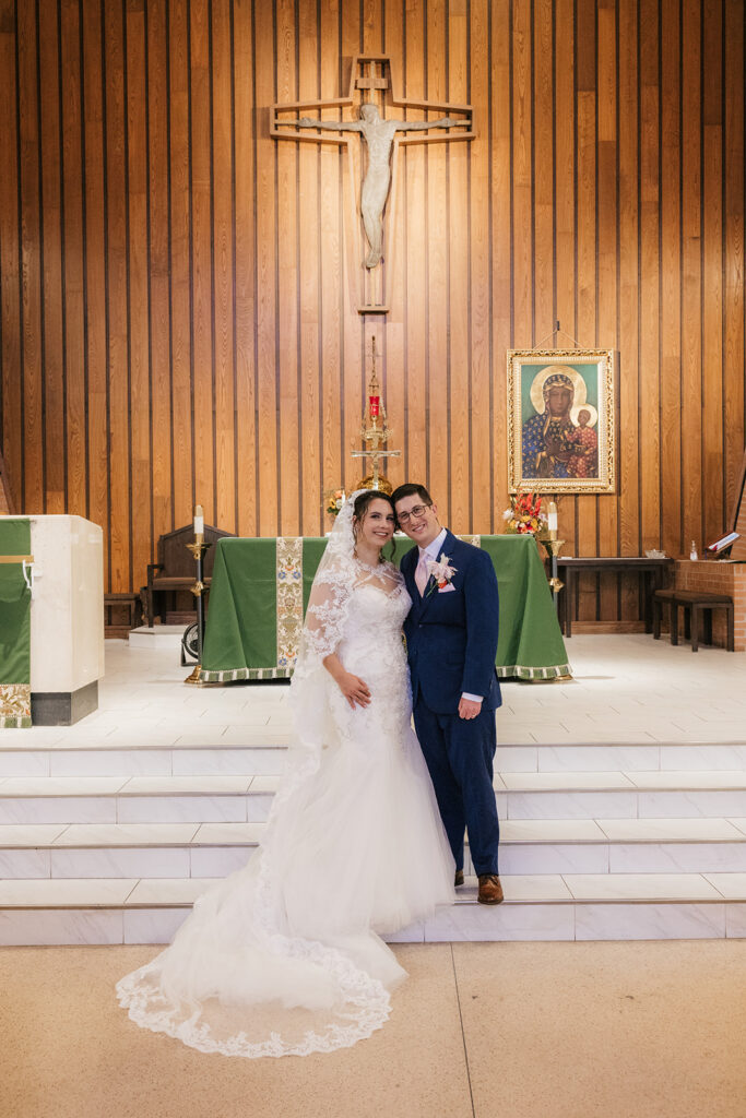cute picture of the bride and groom smiling at the camera during their bridal portraits
