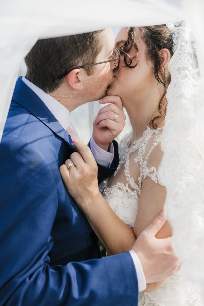 cute picture of the newlyweds kissing