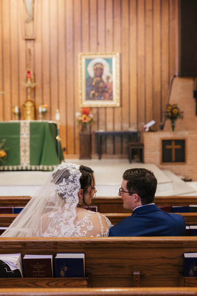 newlyweds smiling at each other during their bridal portraits
