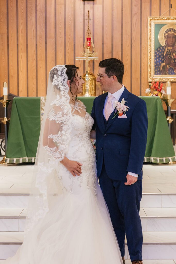 cute picture of the bride and groom smiling at each other
