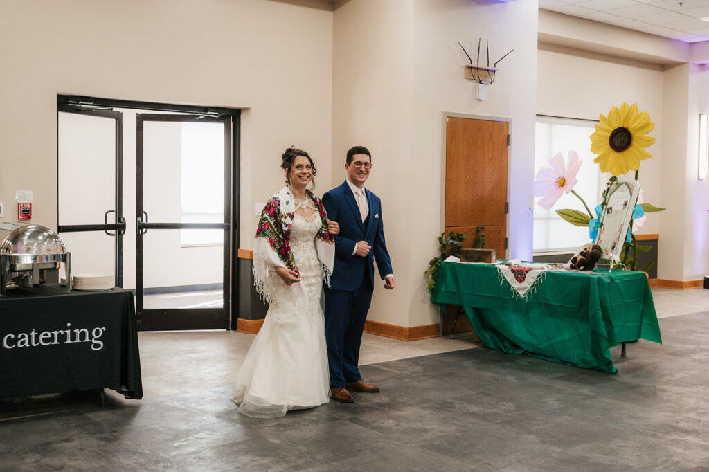 cute picture of the newlyweds arriving at their wedding reception