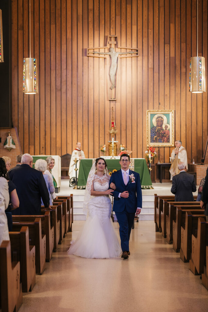 Cute picture of the newlyweds kissing after their ceremony