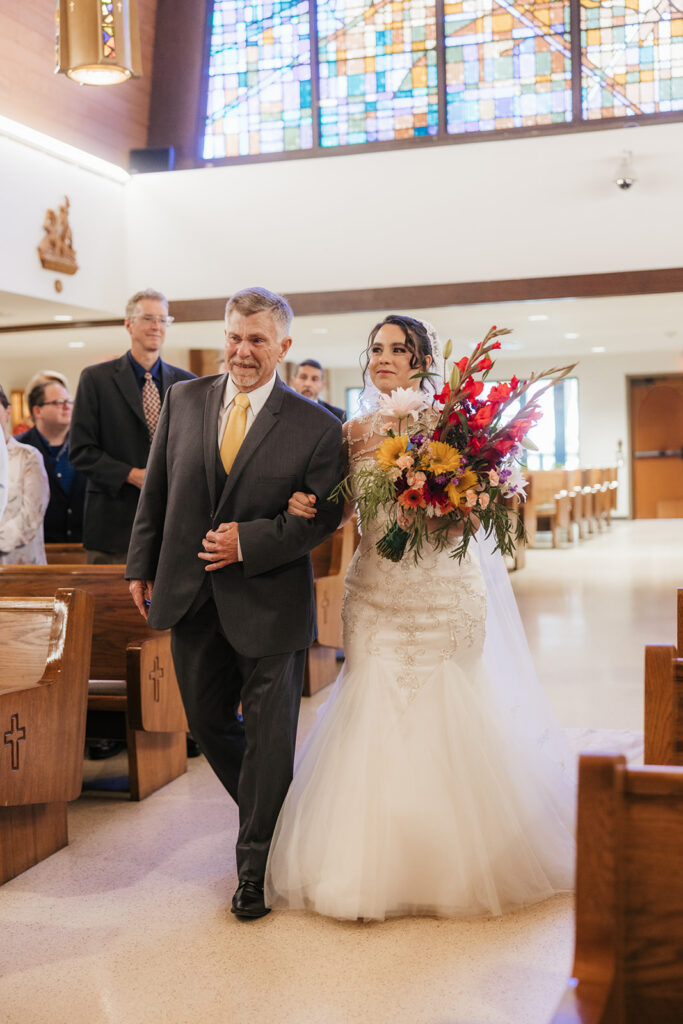 Beautiful picture of the bride walking down the aisle