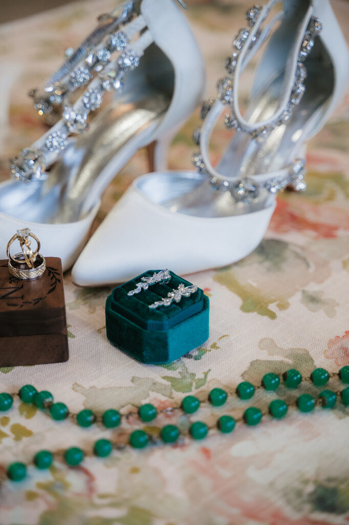 Close-up shot of the wedding shoes and wedding rings